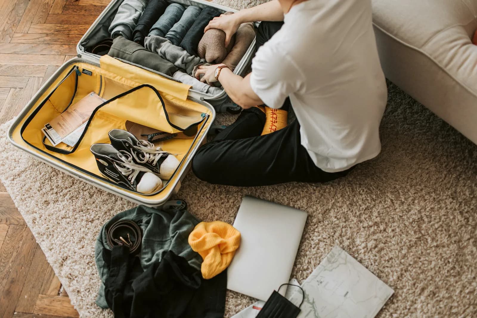 Organized partner hospital bag with practical essentials including hoodie, snacks, and charger