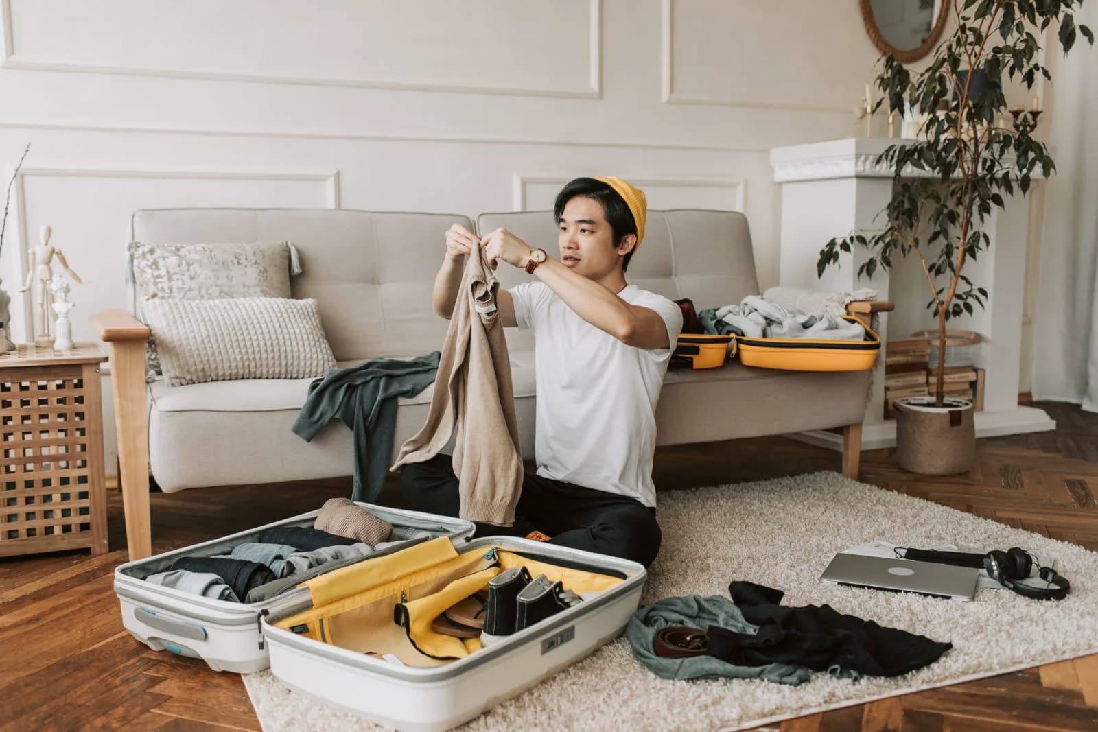Birth partner packing a hospital bag with clothes, charger, and essentials before labor