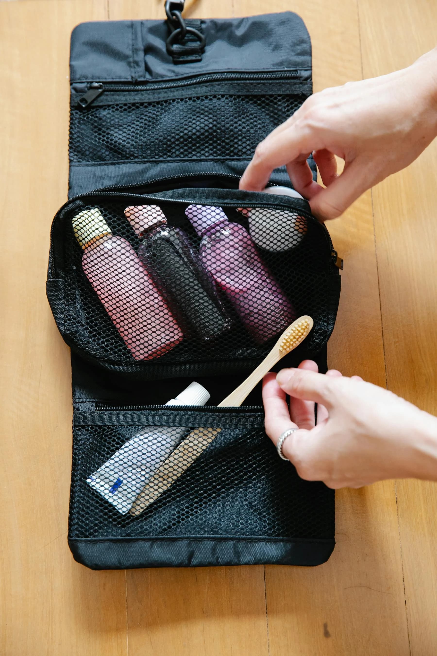 Organized toddler carry-on bag with snacks, tablet, wipes and entertainment for airplane travel