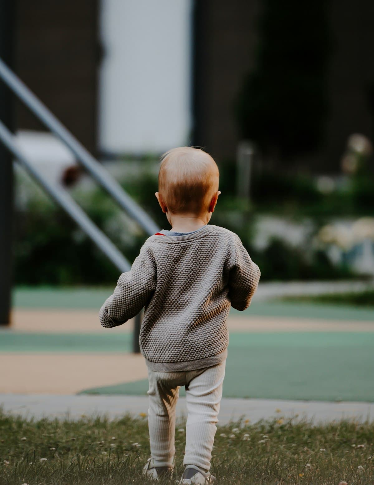 Child playing happily on a sunny summer day outdoors